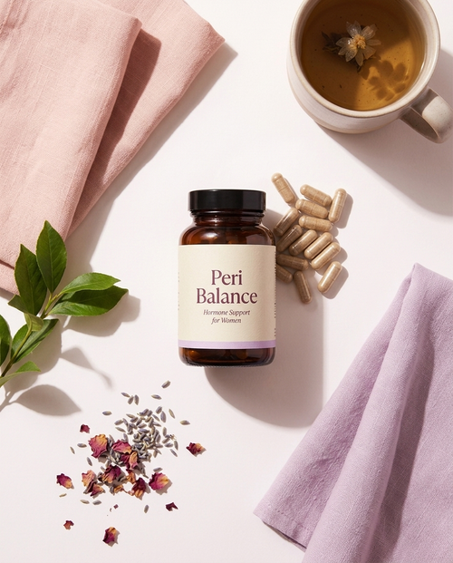 Peri Balance flat lay with herbal tea, capsules and botanicals